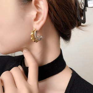 Chic gold and silver plated C-shape stud earrings with industrial rivet texture