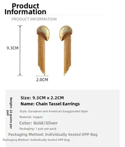 Detail view of gold tassel chain earrings with 9.3cm length and 2.2cm width measurements
