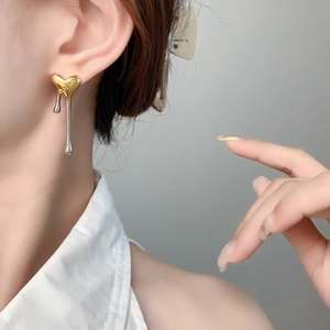 Unique two-tone gold and silver liquid heart earrings with a melting drop design for women