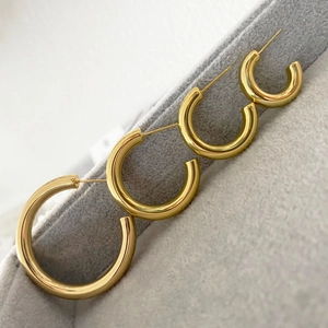 Minimalist hollow tube brass hoop earrings set in four sizes with polished gold finish