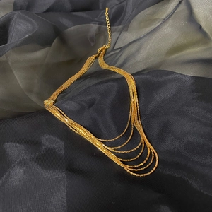 Multi-layer gold chain necklace with five tiered strands and adjustable lobster clasp