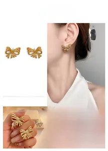 Detailed view of hollow gold-plated bow earrings featuring zircon accents and textures