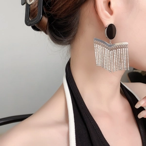 Bohemian chain tassel earrings with black oval stud and shimmering rhinestones