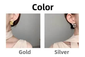 Detailed close-up of irregular wave-shaped gold and silver earrings on model ears
