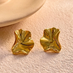 Irregular wave pattern gold earrings with high polish finish for a minimalist look