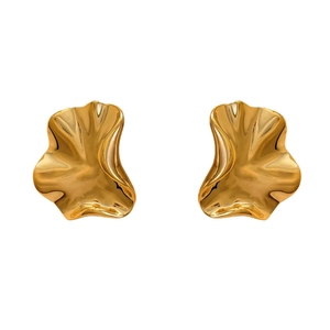 Irregular wavy gold earrings with high-polish organic texture on white background