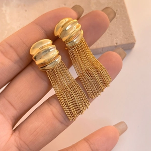 Gold tassel drop earrings with ribbed spherical stud and multiple thin metallic chains