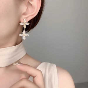 Close-up of double clover earrings with marquise-cut zircon in 18K gold plating