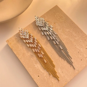 Zircon tassel earrings in gold and silver finish with long beaded chain fringe