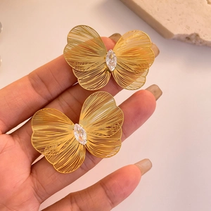 Elegant gold butterfly stud earrings with hollow wings and marquise-cut zircon stones