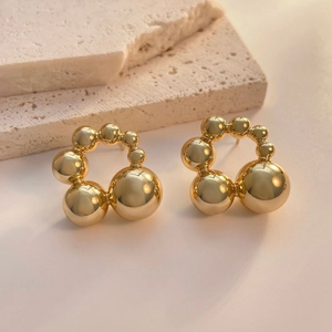 Chic gold beaded round earrings with polished spheres in a unique 3D circular design