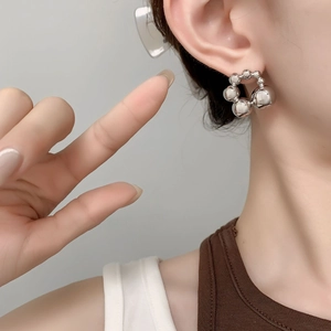 Polished silver beaded sphere hoop earrings for women in a minimalist modern style