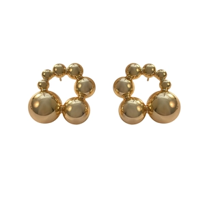 Minimalist gold beaded ball stud earrings featuring a three-dimensional spherical design