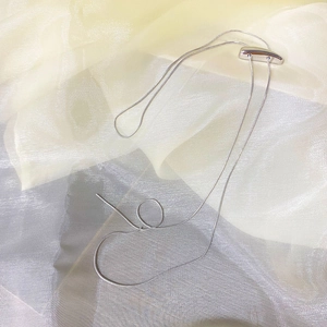 Minimalist silver snake chain necklace with an adjustable long bar slider clasp
