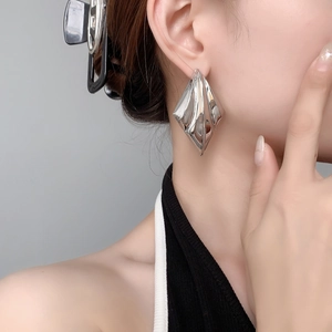 Geometric layered diamond-shaped earrings in polished silver finish for a modern look