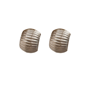 Modern C-shaped champagne gold ribbed earrings with unique texture and a wide arc design