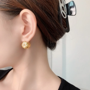 Gold plated flower hoop earrings with sparkling zircon stones in a vintage clover design