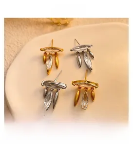 Detailed view of elegant leaf tassel earrings with sparkling zircon and gold-plated finish