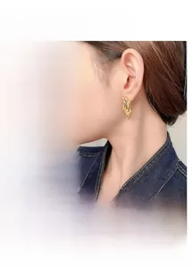 Detail of marquise-cut zircon tassel earrings in gold and silver plating options