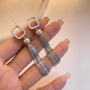 Silver square geometric earrings featuring long chain tassels in a minimalist modern style