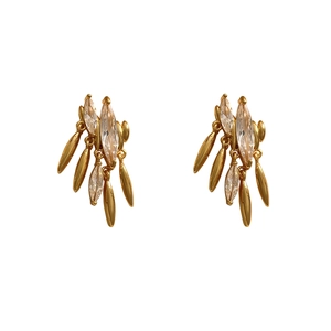 Golden fringe earrings with marquise zircon and leaf-shaped tassels on white background