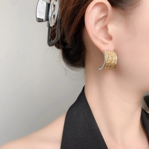 Modern C-shaped earrings with gold and silver bicolor lava texture for women