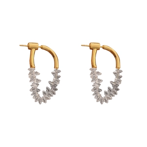 Elegant gold hoop earrings featuring sparkling irregular white cubic zirconia stones