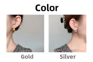 Detail of double-layered C-shaped hoop earrings in gold and silver finish options