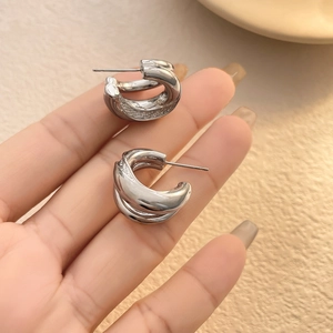 Minimalist double layered C-shaped silver earrings in polished geometric stacked style