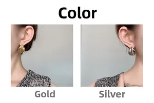 Detailvergleich von minimalistischen Tropfenohrringen in Gold und Silber am Model