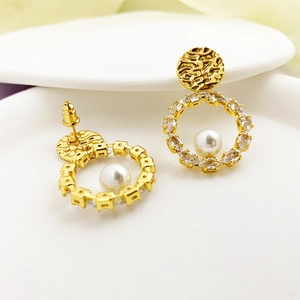 Lava texture gold earrings with sparkling zircon and pearl in a vintage French style