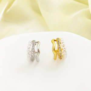 Elegant gold and silver triple-layered hoop earrings with pearls and zircons