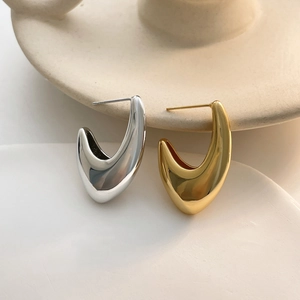 Polished hollow hook earrings in gold and silver finish with minimalist drop design