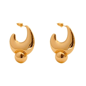 Polished gold horn and moon drop earrings with glossy metal spheres on white background