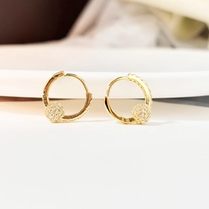 Elegant gold-plated hoop earrings featuring micro-pave cubic zirconia and drop charm