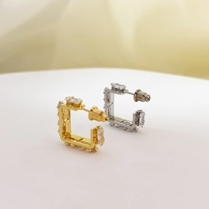 Elegant gold and silver square stud earrings set with rectangular zircon crystals