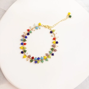 Detail of bohemian rainbow beaded necklace with 14K gold plated chain and lobster clasp