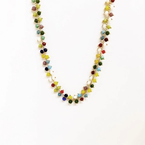 Close-up of bohemian colorful faceted beads on a 14K gold plated chain necklace
