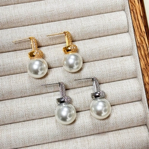 Elegant 18K gold plated pearl stud earrings with sparkling cubic zirconia geometric accents