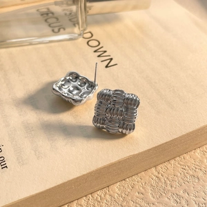 Silver square quilted earrings with woven texture and high-polish metallic finish