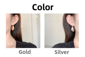 U-shaped thick geometric earrings in gold and silver finish shown on model
