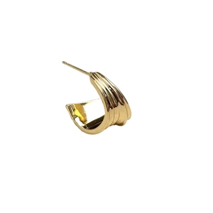 Golden C-shaped earrings featuring a vertical multi-layered rippled texture and metal finish