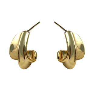 Modern minimalist gold crescent-shaped C-stud earrings with a polished metallic finish