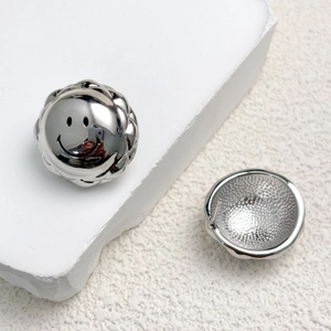 Close-up of S925 sterling silver smiley face stud earring with polished mirror finish