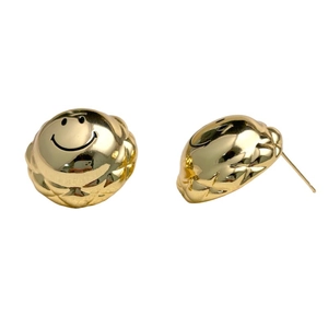 Golden smiley face stud earrings with elegant quilted texture and minimalist design