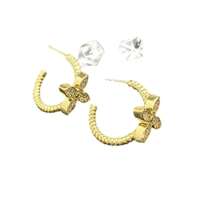 Gold C-shaped spiral hoop earrings with pavé butterfly charms and cubic zirconia