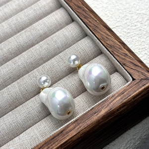 French Baroque S925 silver earrings featuring natural iridescent pearls on a display box