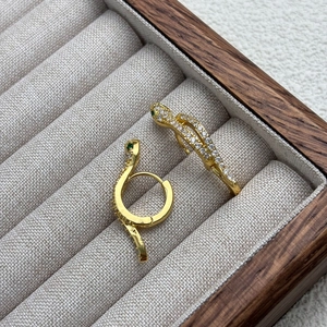 18K gold plated snake hoop earrings with white cubic zirconia and green gem eyes