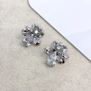 Elegant silver flower stud earrings with zircon petals and teardrop-shaped drop stone