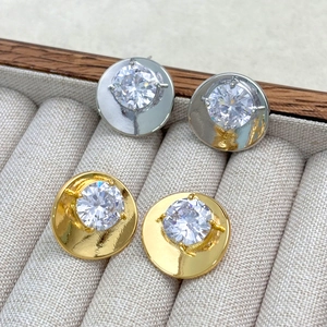 Luxurious gold and silver stud earrings set featuring faceted zircon stones in claw setting
